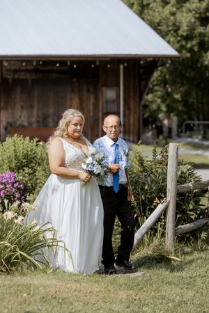 Bride and groom walk down ceremony aisle during summer wedding at Blueberry Hill Farms, New Brunswick experienced wedding photographer