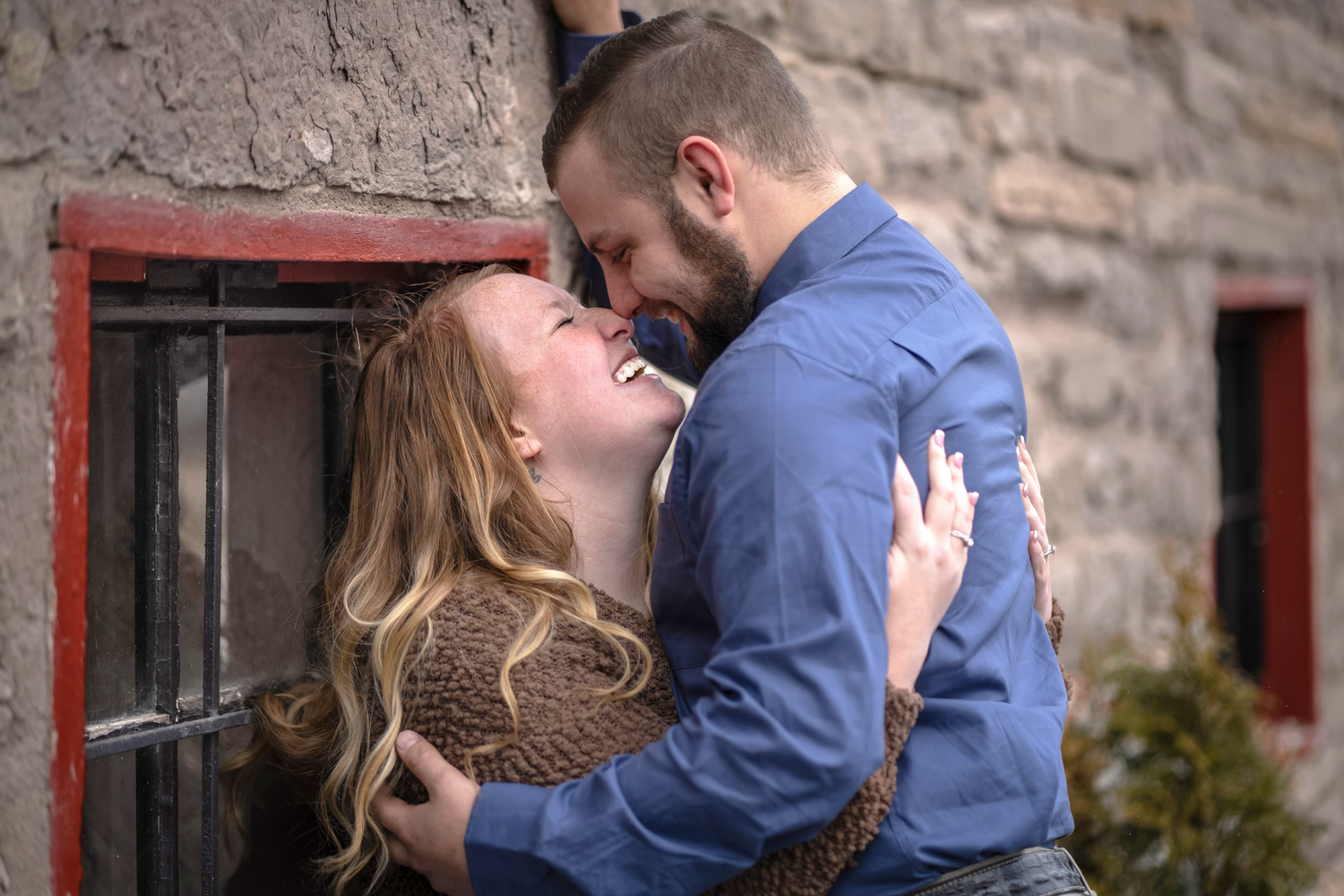 A couple shares romantic moments in a series of engagement photos