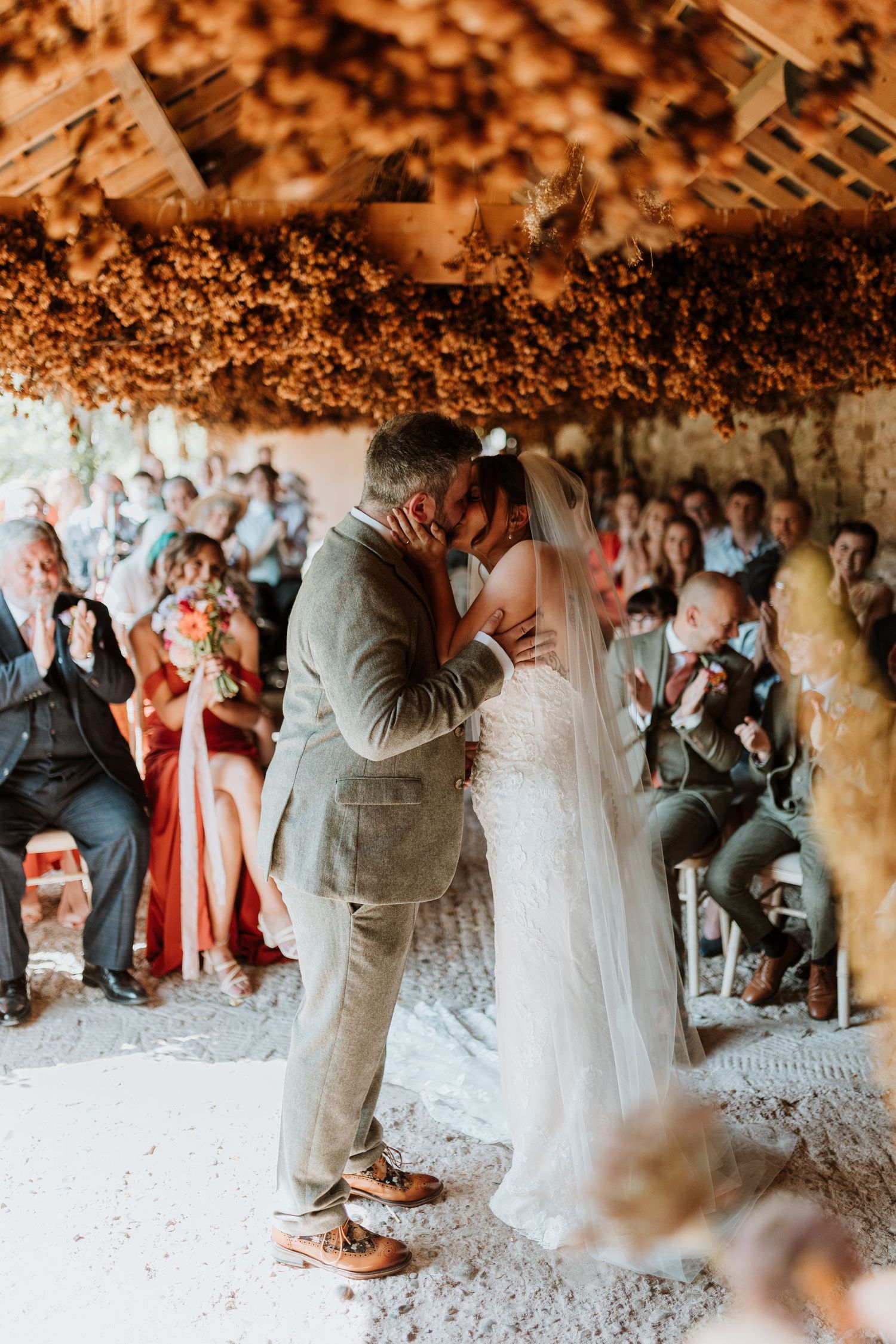First kiss between couple at wedding at Lyde Court, Hereford.