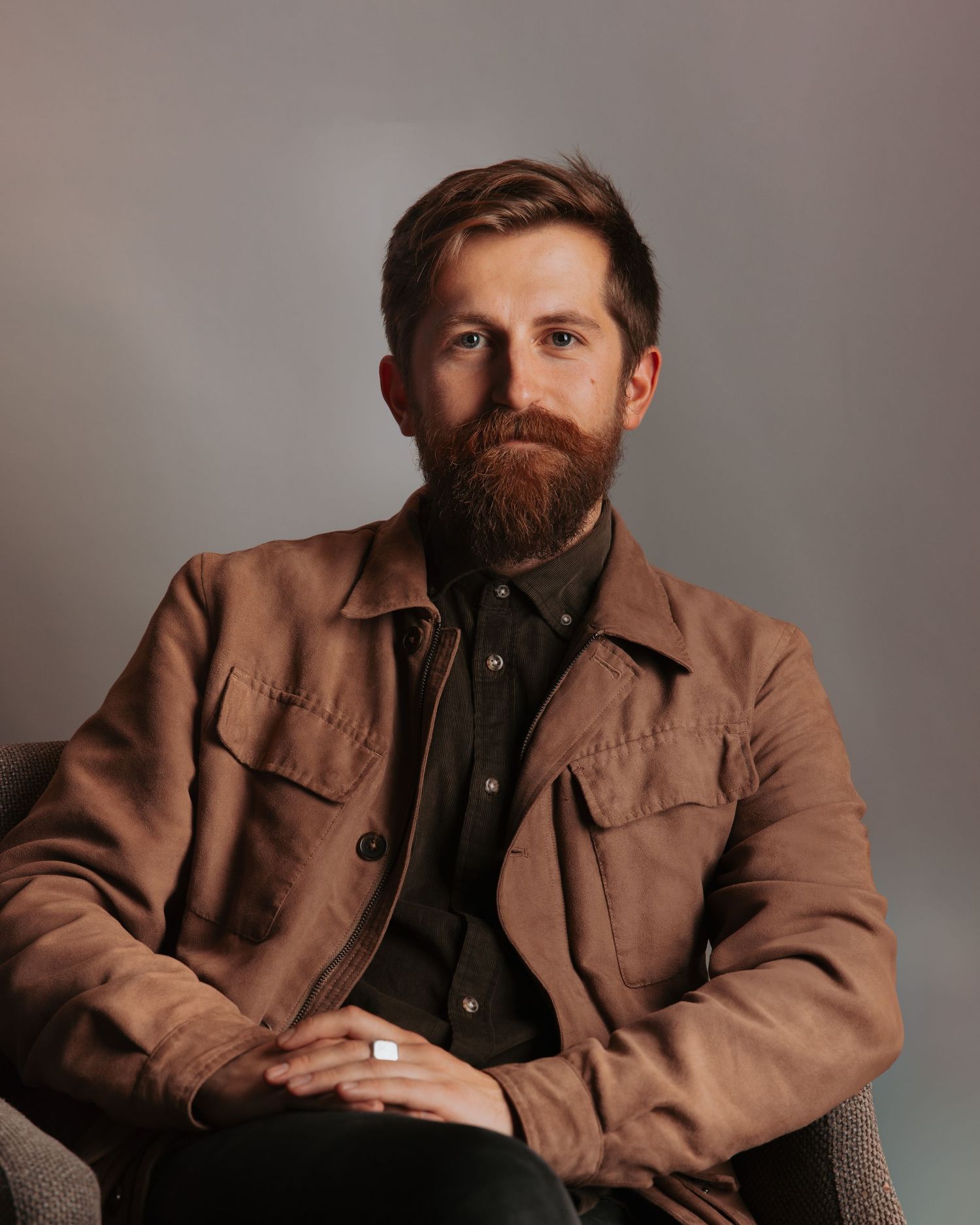 Portrait series showing person in brown jacket against neutral background.