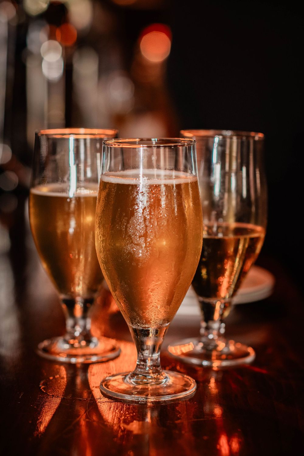 3 glasses of craft beer sitting on a table at a brewery in Lindsay, Ontario.