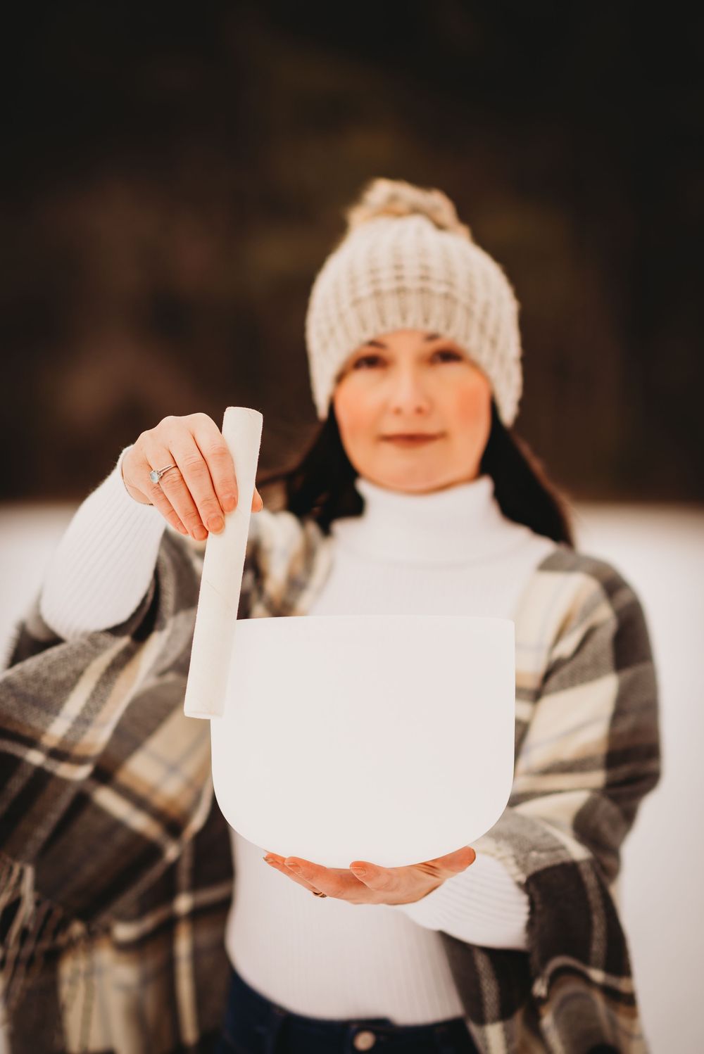 A woman posing with her singing bowl for an outdoor branding photoshoot in Bolsover, Ontario.