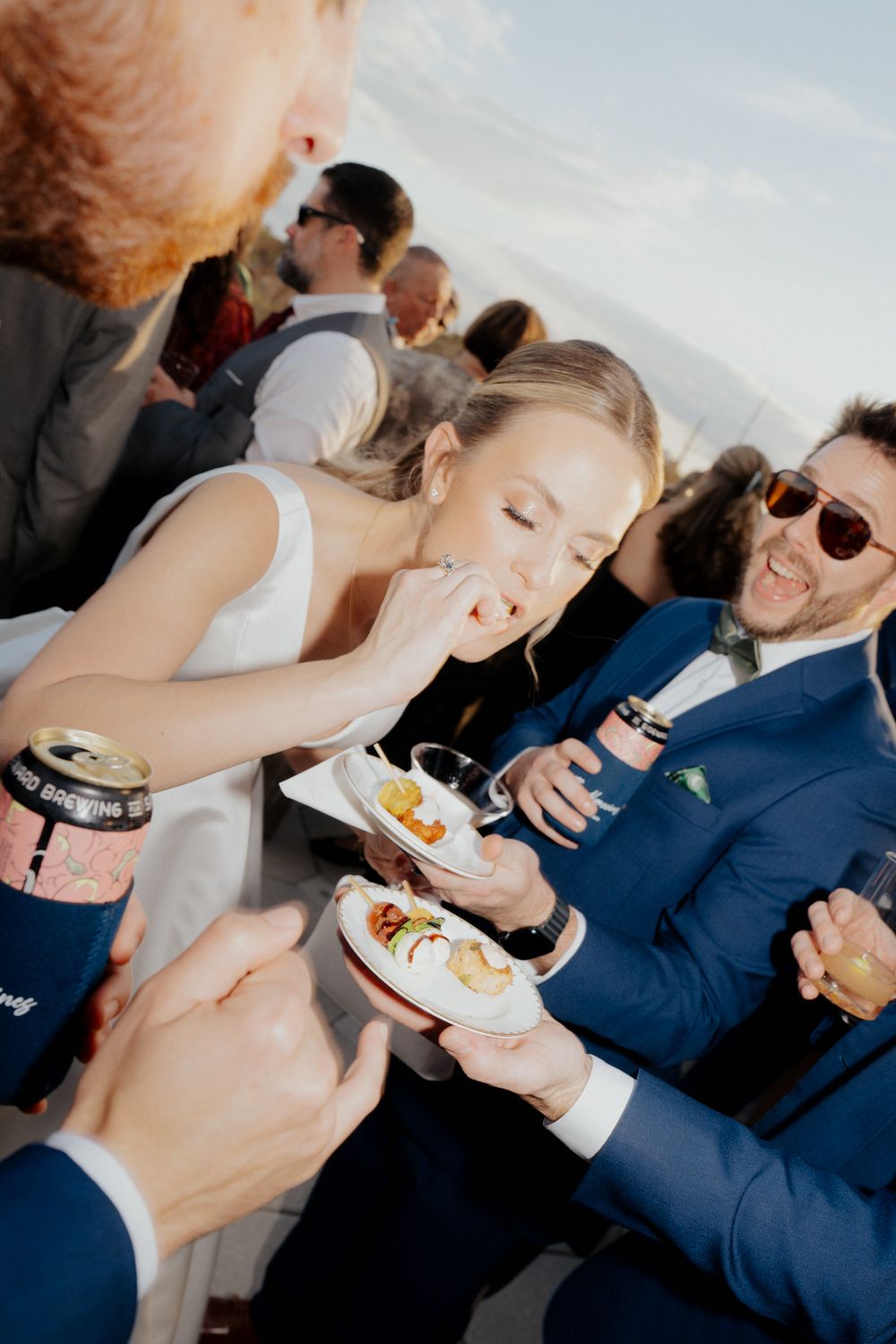 Wedding guests enjoying appetizers and laughing together during cocktail hour at winter park events center