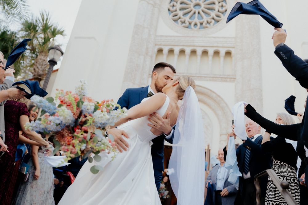 Newlywed couple sharing a romantic dance at their outdoor wedding reception with guests watching and celebrating at st james cathedral