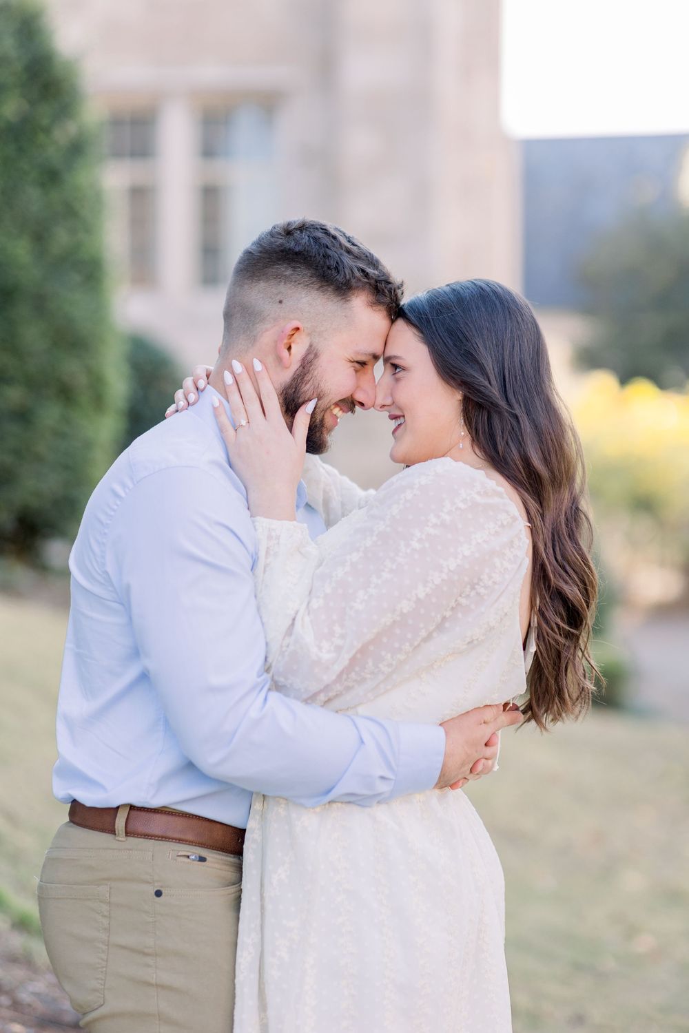 Couple shares intimate embrace during outdoor autumn photo session.