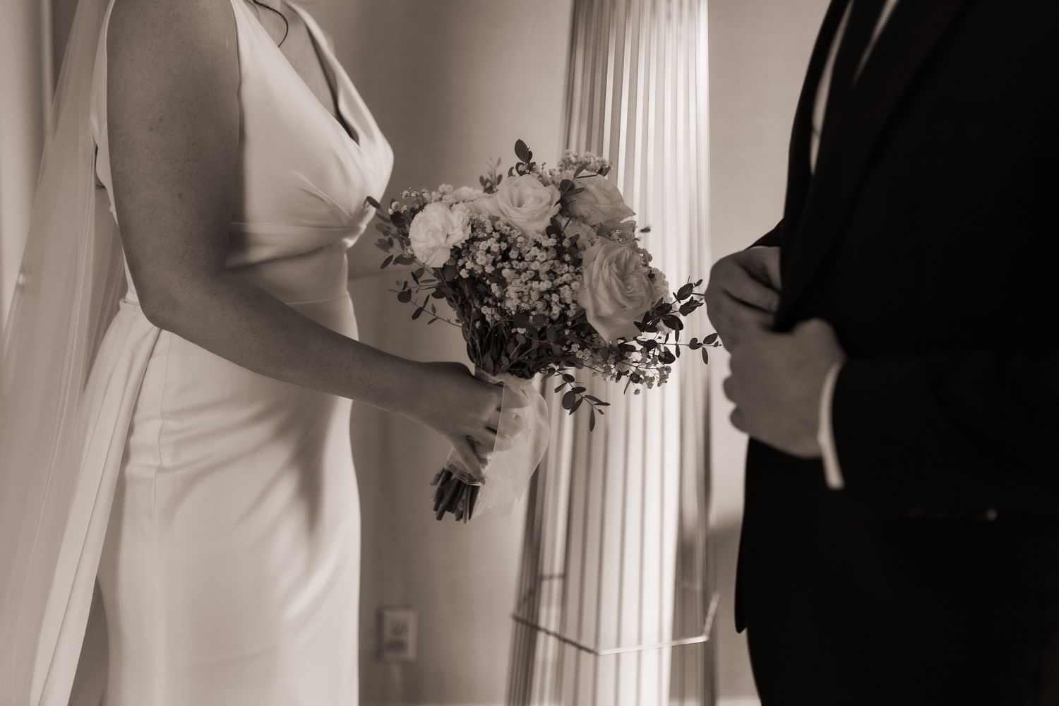 A black and white collage of wedding photos showing details of bridal gowns and bouquets.