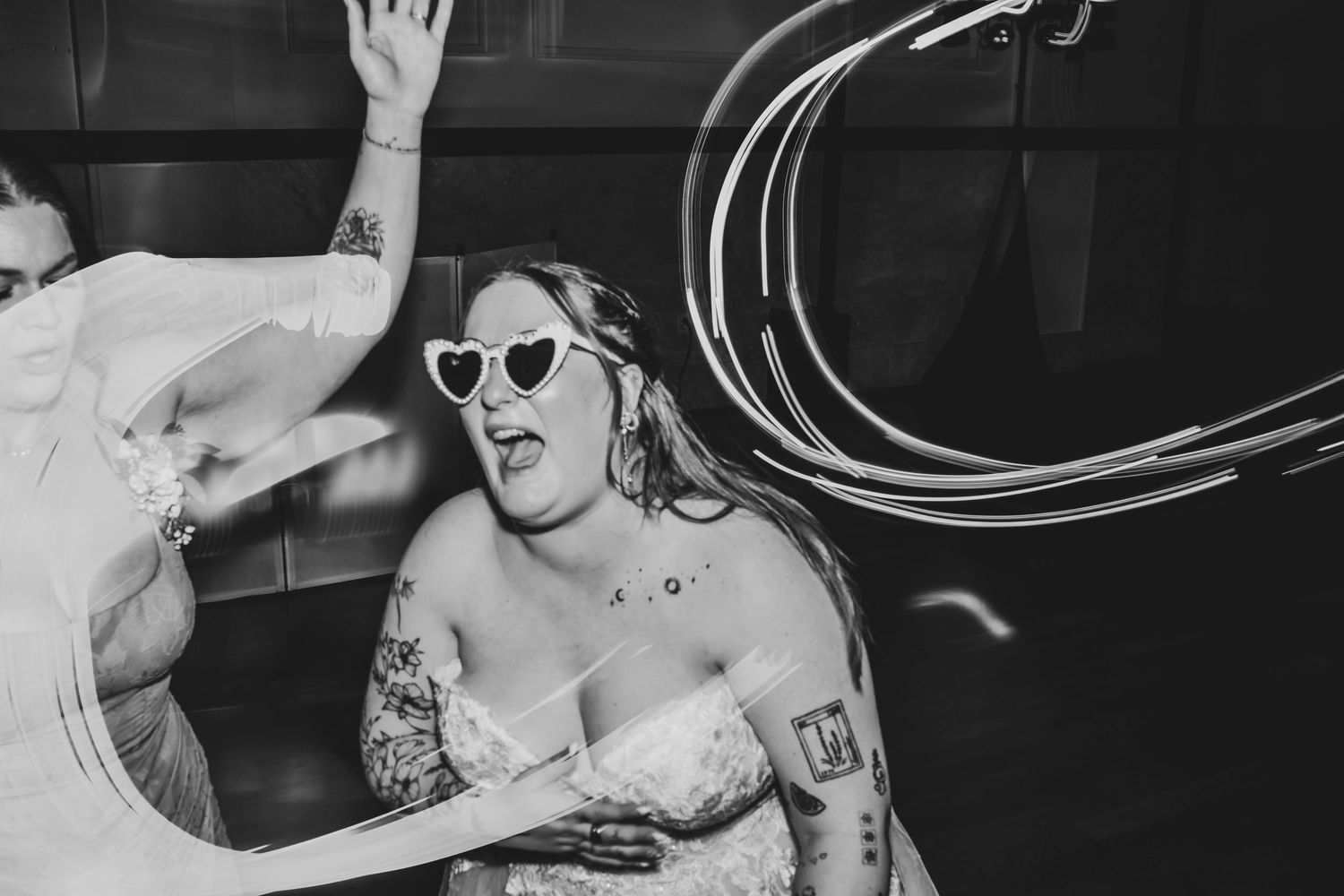 Bride and groom celebrating on the dance floor during their modern Fort Worth wedding reception