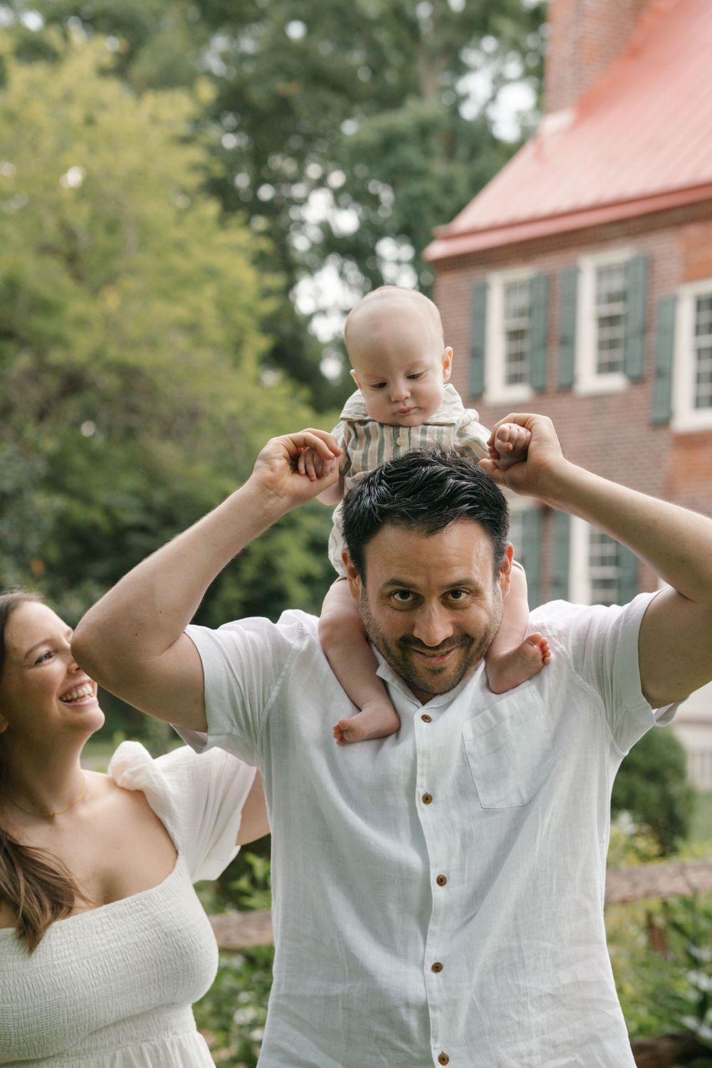Baby sitting on daddy's shoulders. Family Photography at Barclay Farmstead, Cherry Hill, NJ.