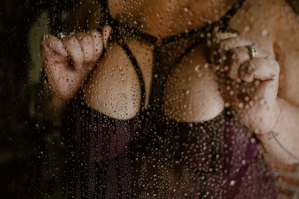 Artistic shower scene with water droplets on glass creating dreamy effect.