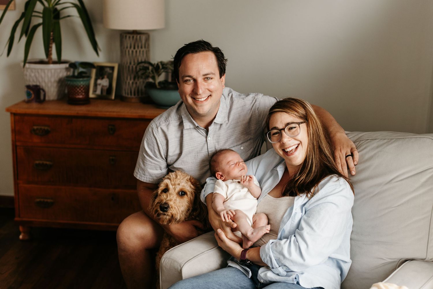 Relaxing at-home photography newborn session with family, baby, and dog in Akron, Ohio.