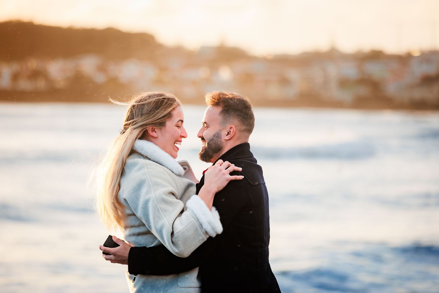 Happy couple embracing after a heartfelt proposal.