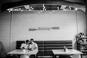 Couple kissing in an intimate brewery