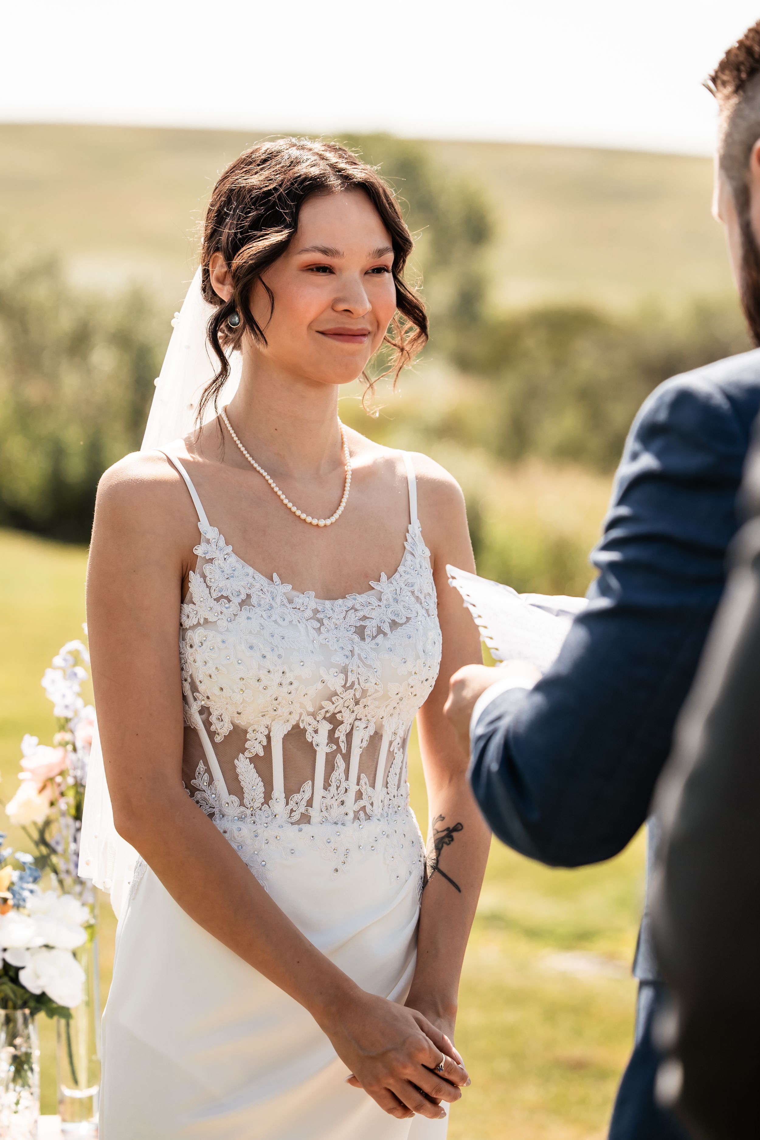 Bride looking the groom during his vows