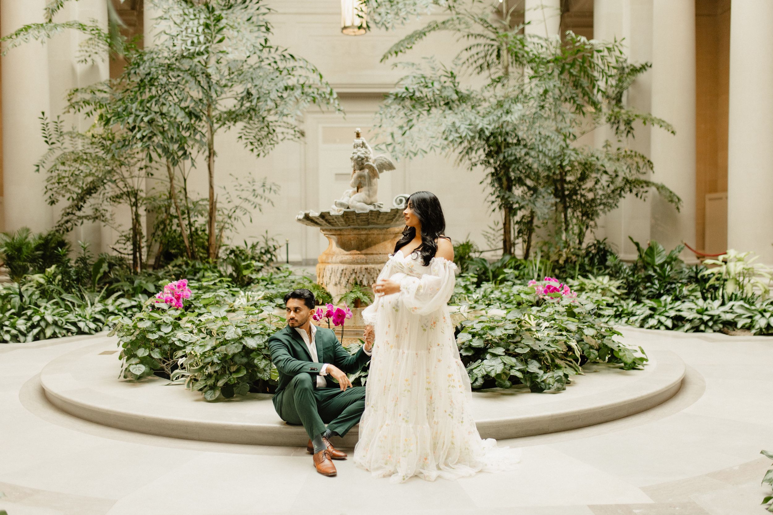 Indoor garden setting with lush plants and flowers creating a romantic atmosphere.
