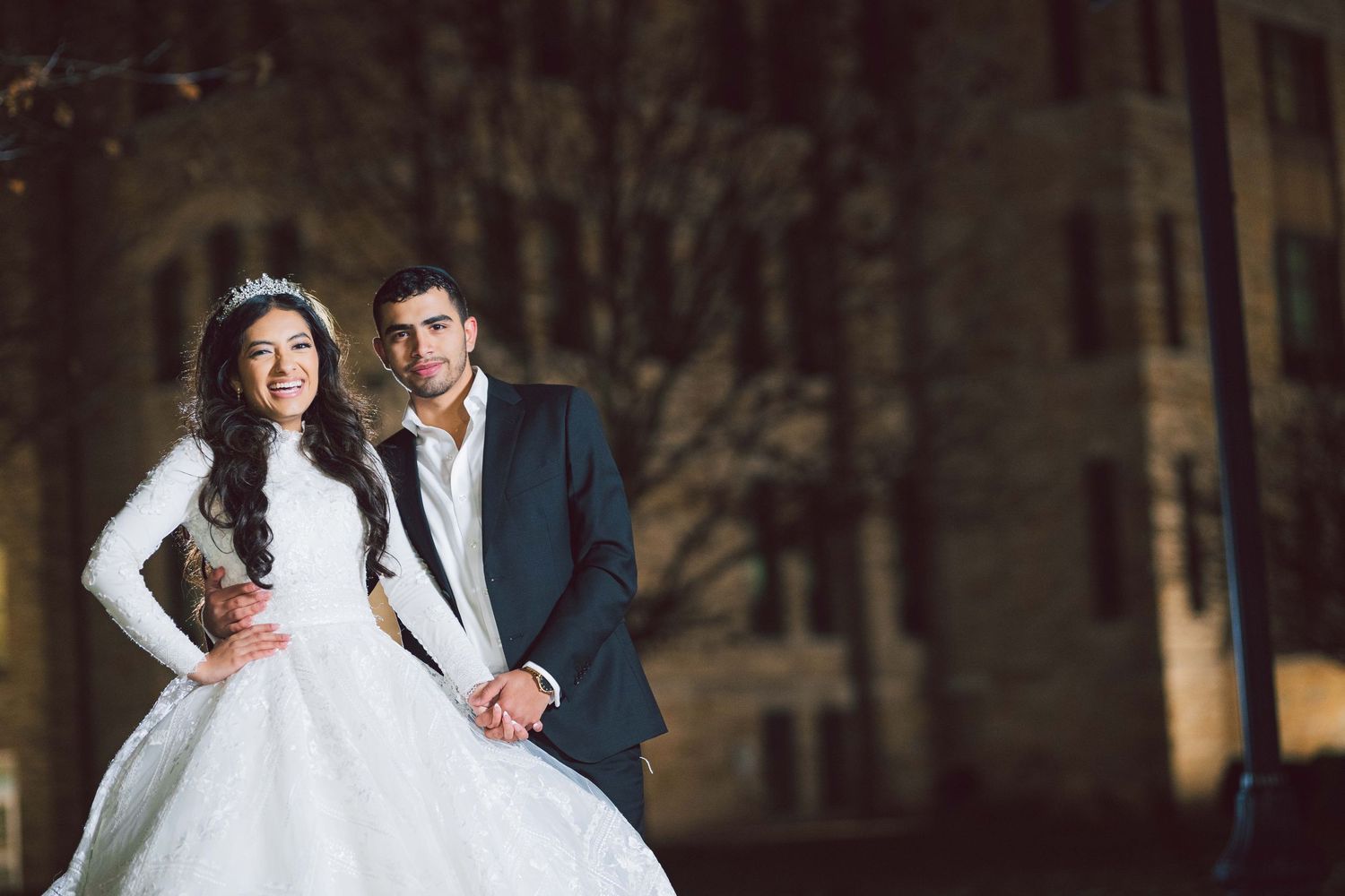 Elegant winter wedding photoshoot in a wooded outdoor setting.