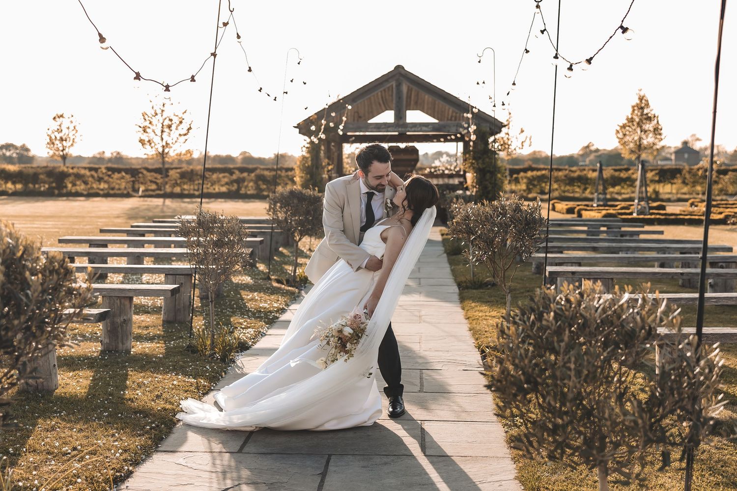 Couple sharing an intimate moment in the venues exterior grounds
