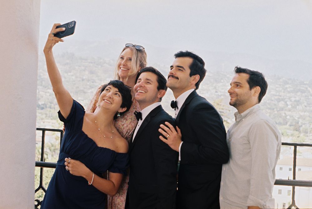 A gay couples friends celebrate with them at the Santa Barbara Courthouse