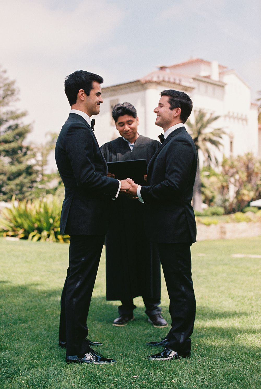 LGBT couple during an intimate elopement ceremony in the Sunken Gardens at the Santa Barbara Courthouse.