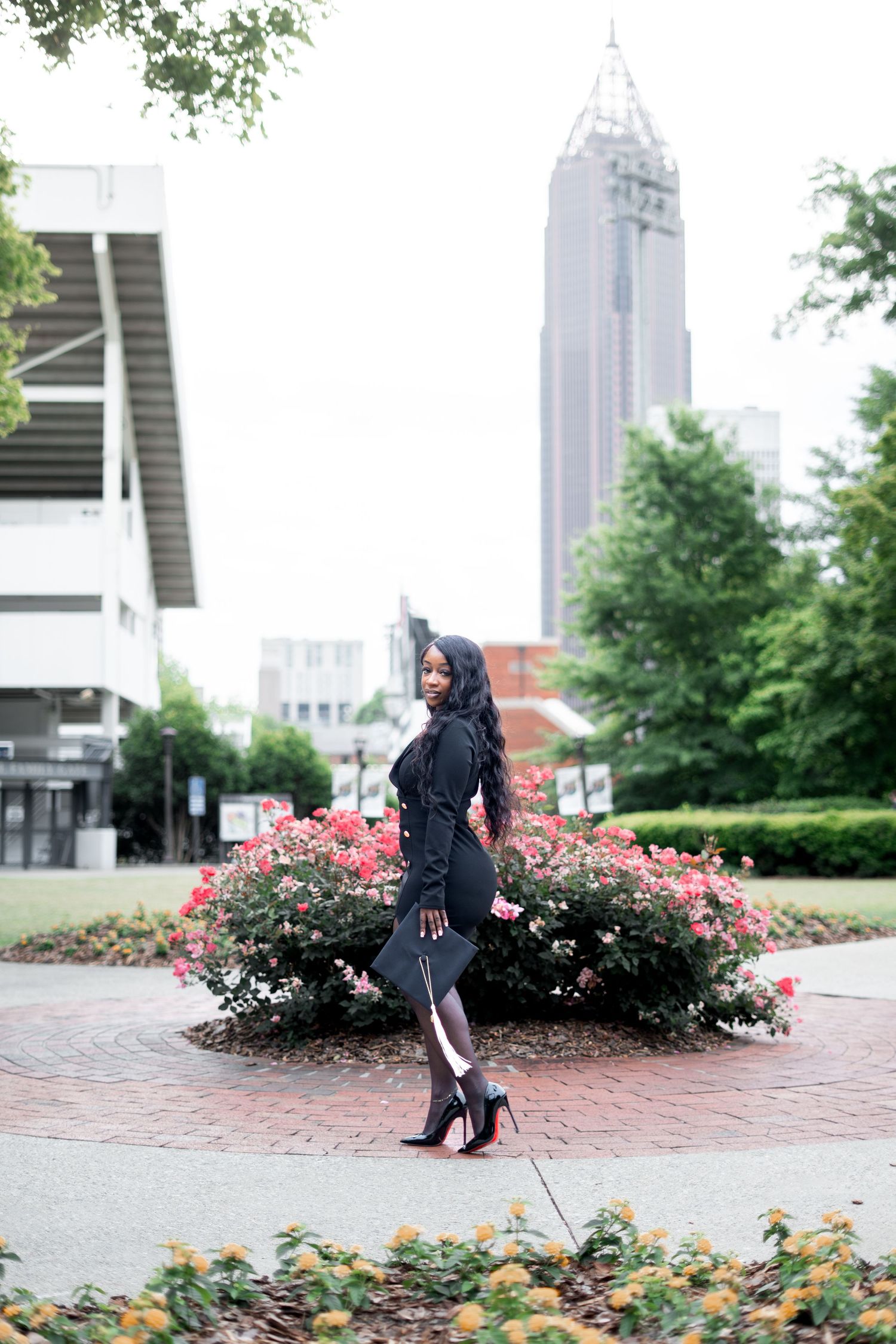 Atlanta city background on tech tower lawn one of the best spots for Georgia Tech photos during your atlanta grad photoshoot