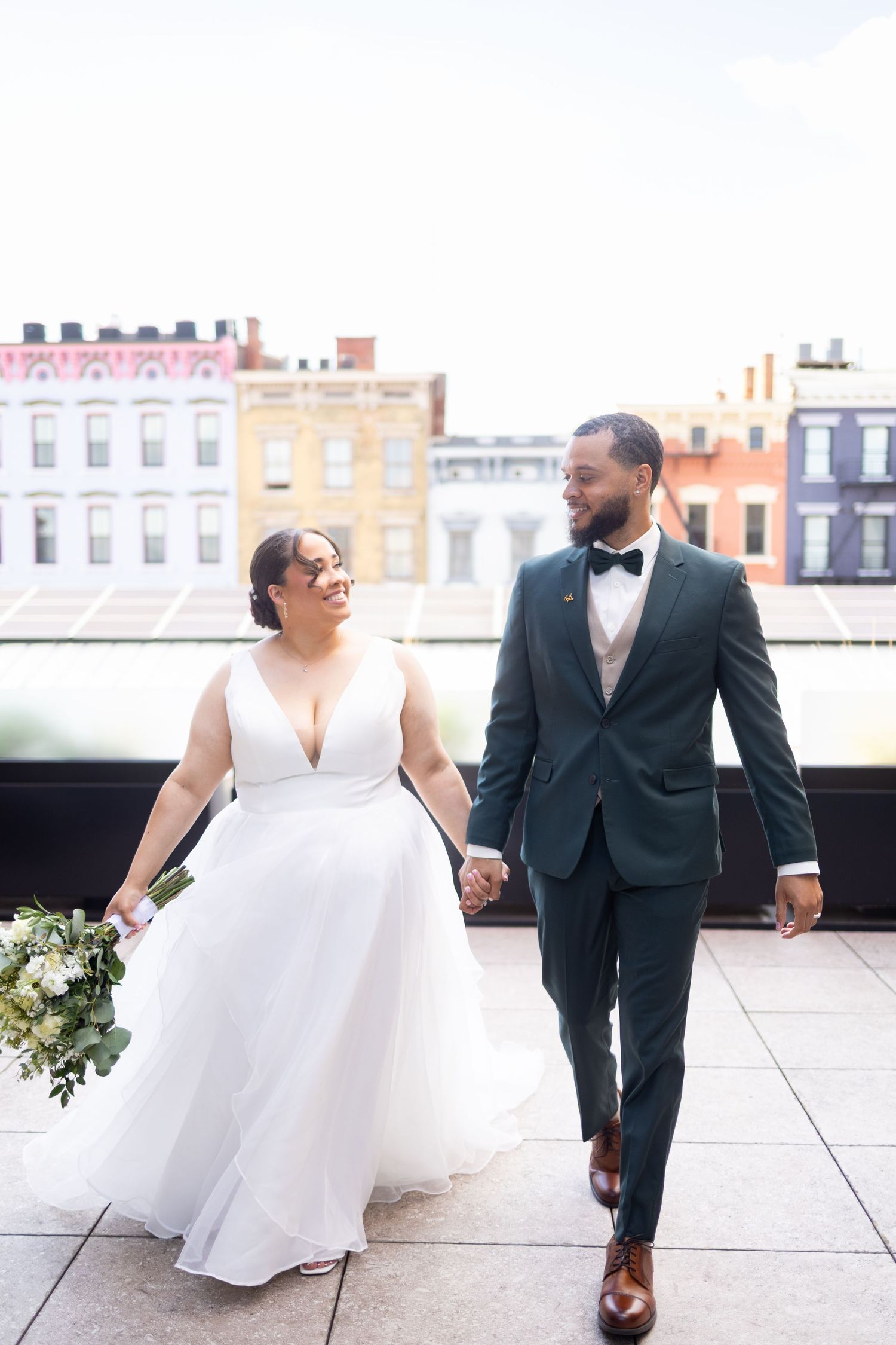 Cincinnati elopement couple walking hand in hand after their intimate wedding ceremony at the Columns