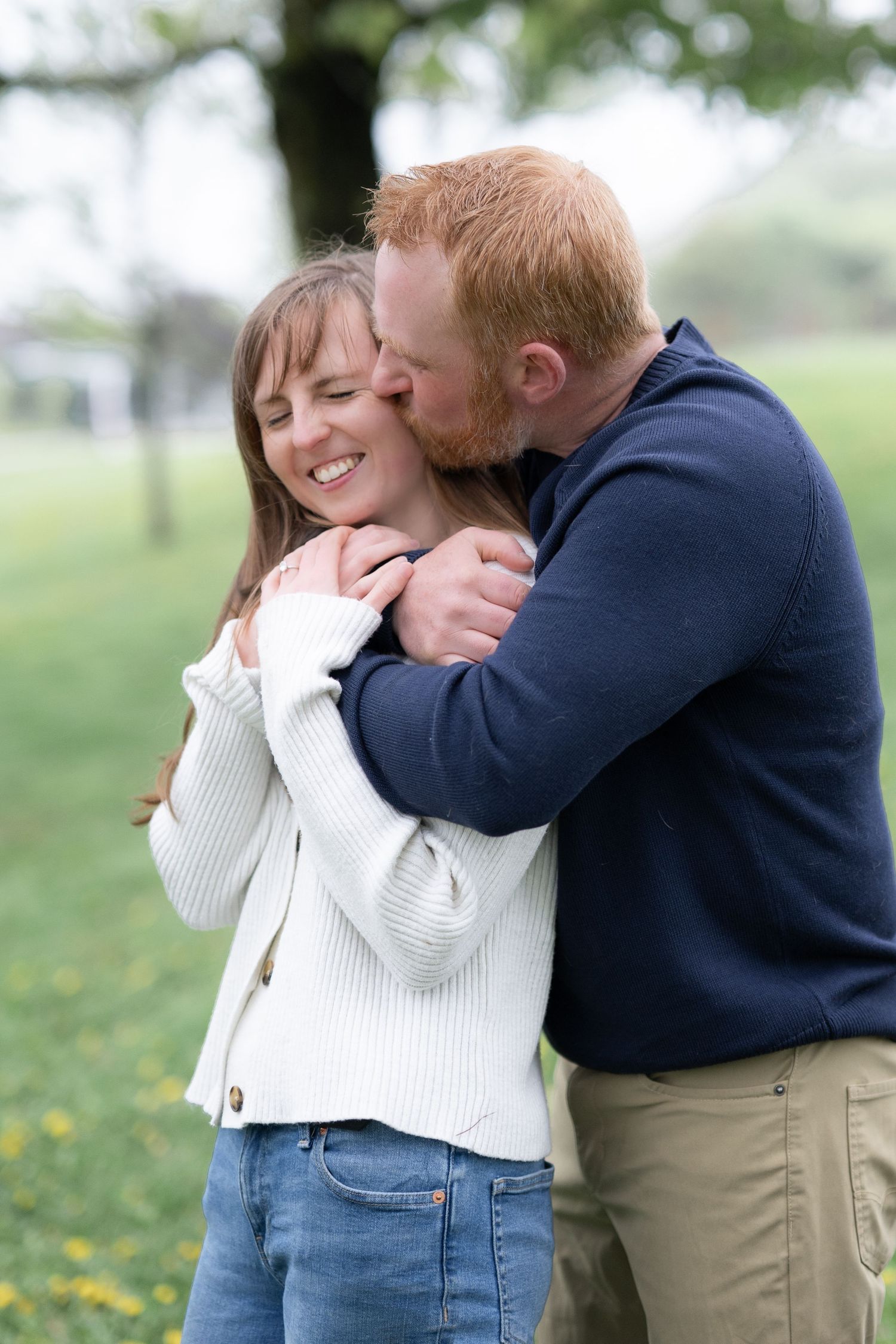 Newly engaged couple gets cozy in the park in Halifax Nova Scotia