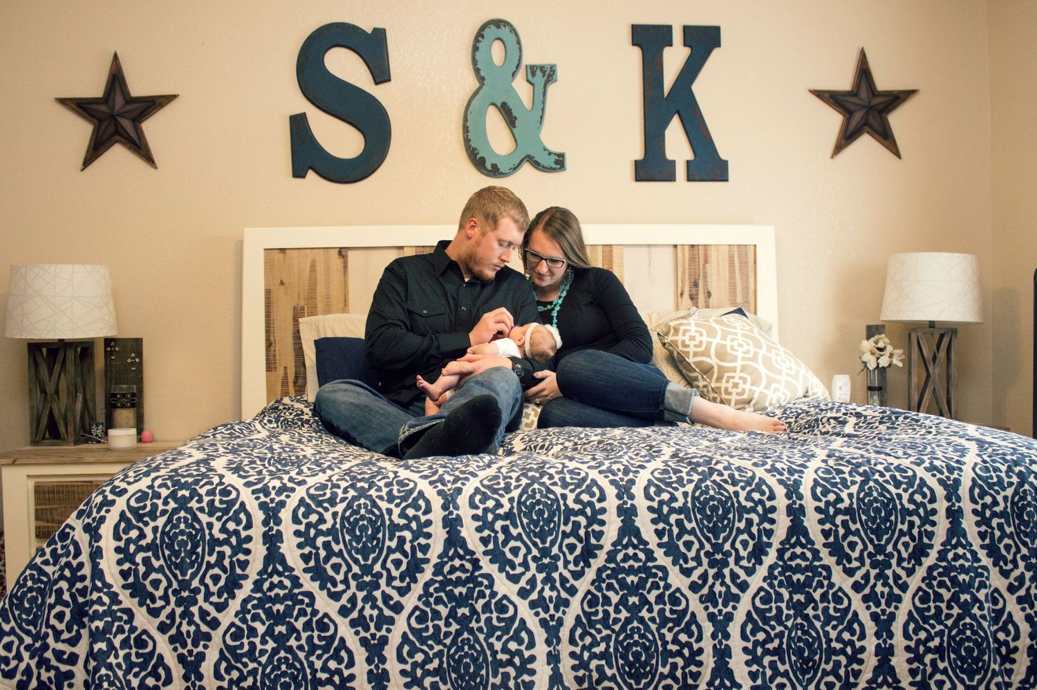 newborn lifestyle photoshoot of baby girl in her crib. Greeley colorado new born photography