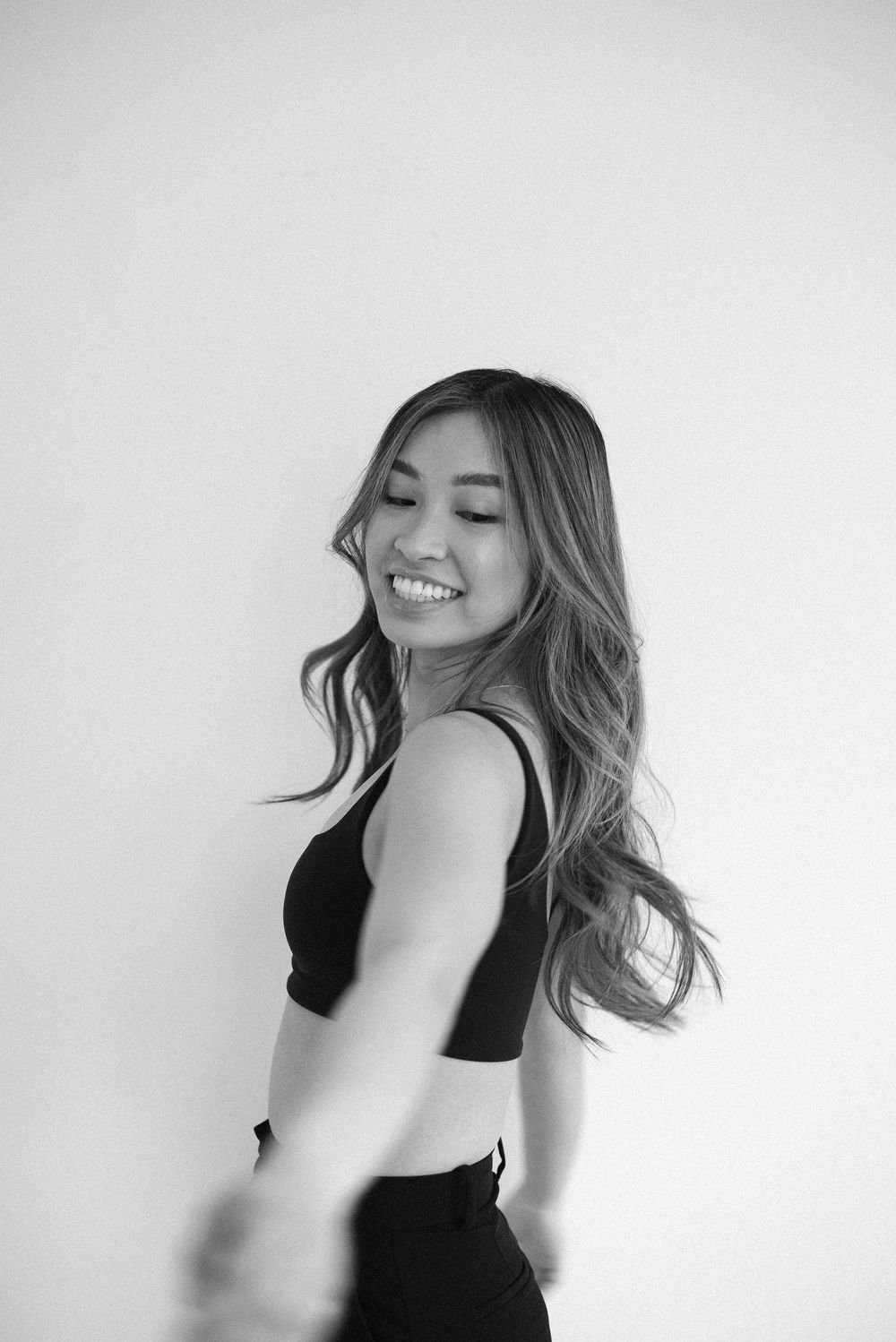 Dynamic black and white portraits showing movement and genuine smiles.