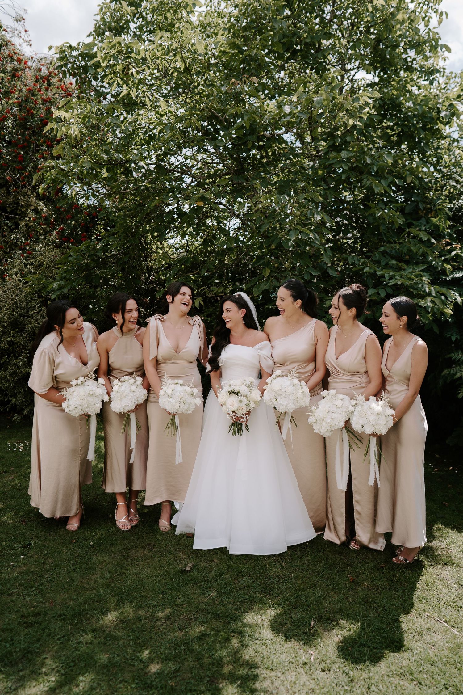 bride and bridesmaids laughing at the new inn cirencester