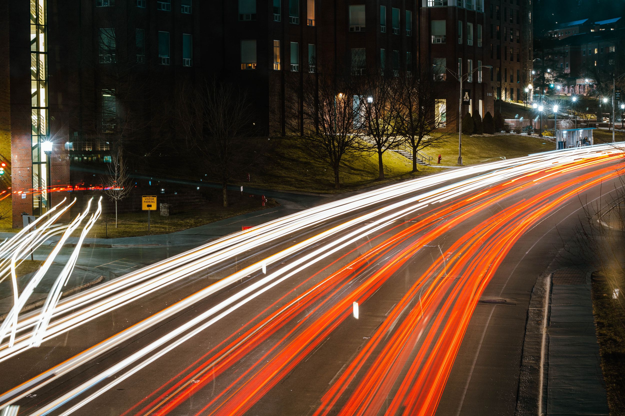 Long exposure of cars going by under bridge