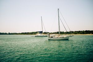 Sail boats in the ocean at dawn