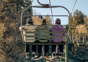mountain Ski resort in winter with skiiers on the lift