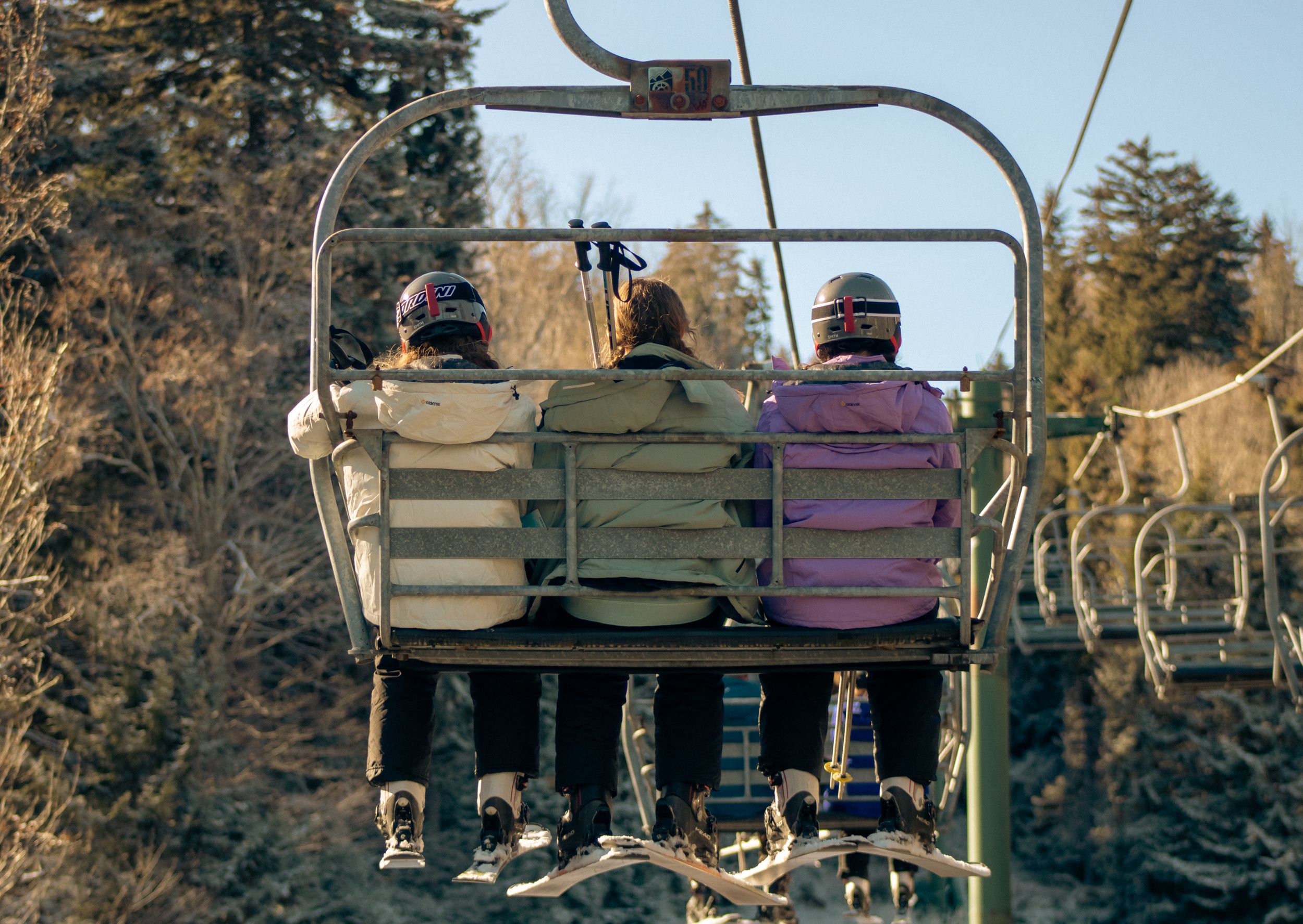 mountain Ski resort in winter with skiiers on the lift