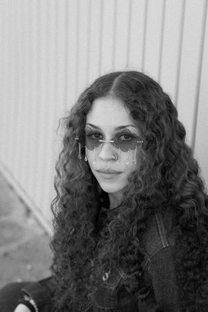 Black and white creative portrait downtown Wichita Falls, moody artistic style.