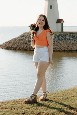 Travel portrait at Oklahoma City lighthouse, dreamy flowers and sunset vibes.