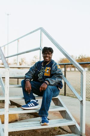 Senior session at Savanna High School McAlester Oklahoma, football field vintage varsity jacket.