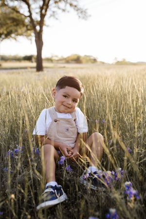 Child in dreamy bluebonnet field Wichita Falls TX, natural spring portrait.