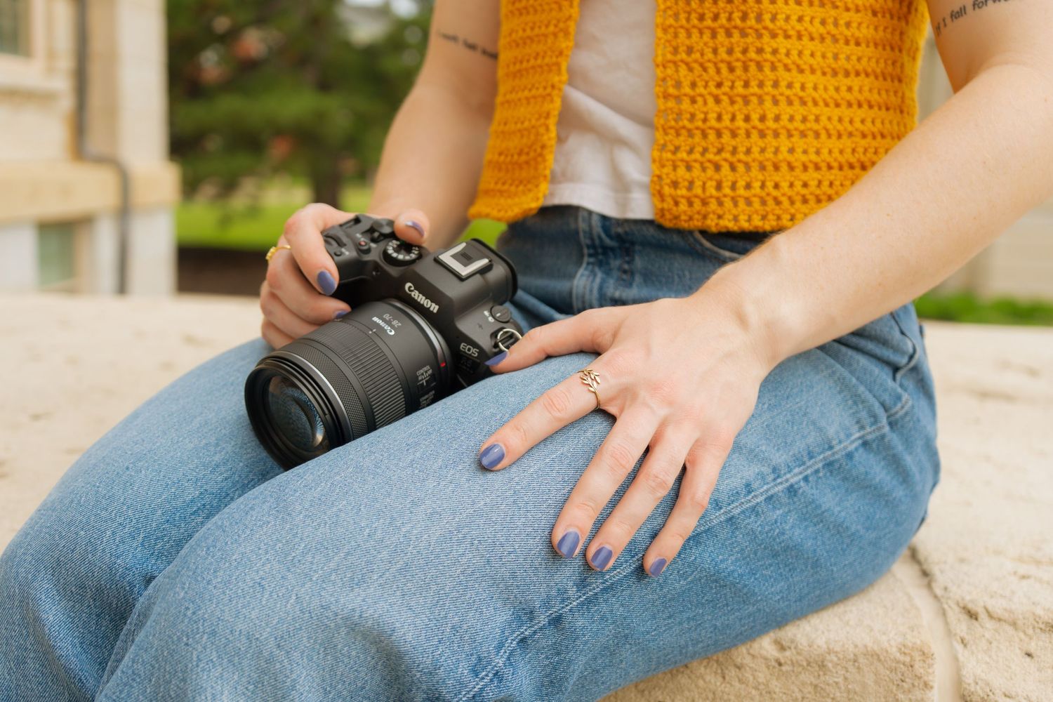 A photographer smiling and holding a camera