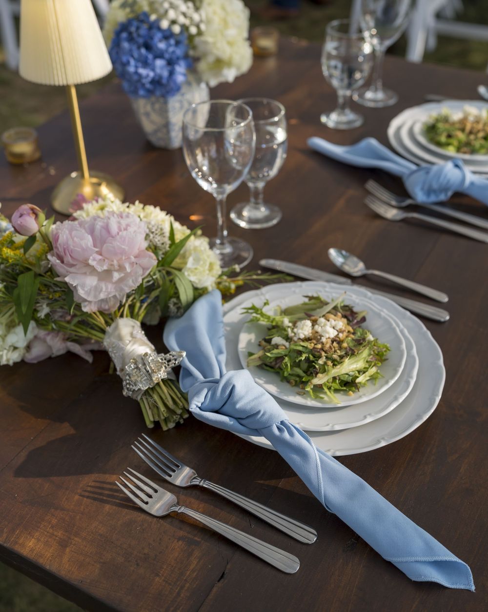 Coastal Maine wedding at the Harpswell Inn with waterfront ceremony and elegant blue‑and‑white reception décor.