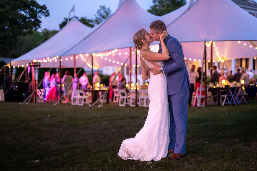 Coastal Maine wedding at the Harpswell Inn with waterfront ceremony and elegant blue‑and‑white reception décor.
