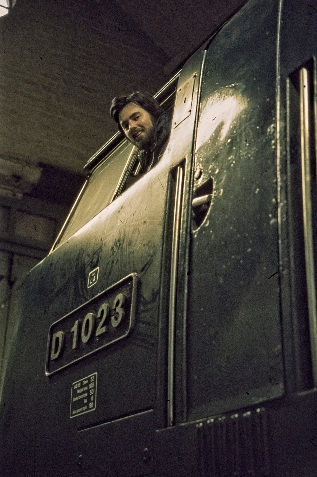 Andy Collett looking out of BR Class 52 Diesel Hydraulic Locomotive D1023 'Western Fusilier' at Swindon Works on 27th February 1977