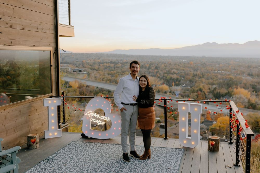A series of scenic outdoor wedding ceremony photos showing a beautiful mountain vista and rustic decor at sunset.