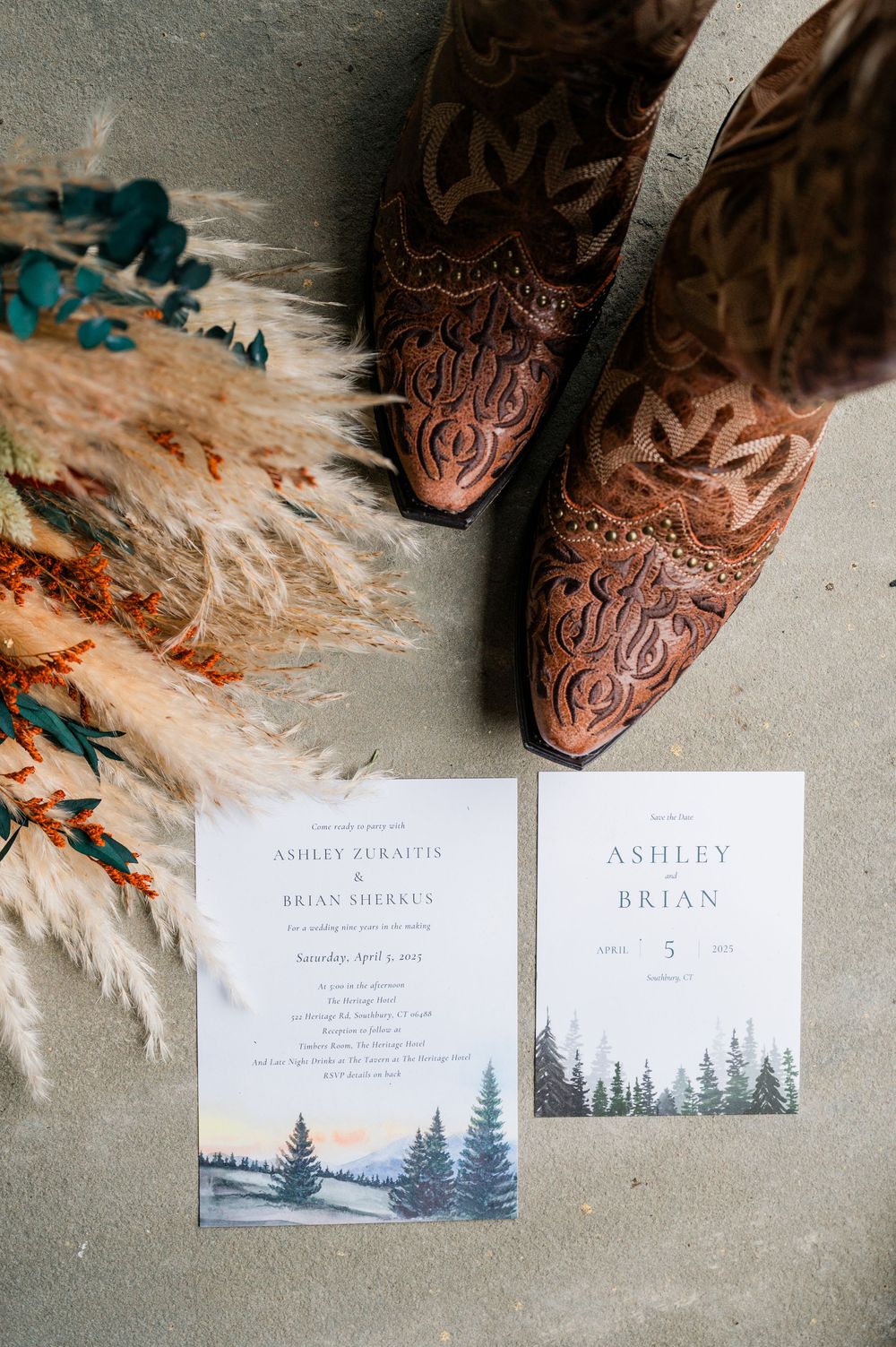 Wedding invitations with forest theme design displayed alongside decorative elements.