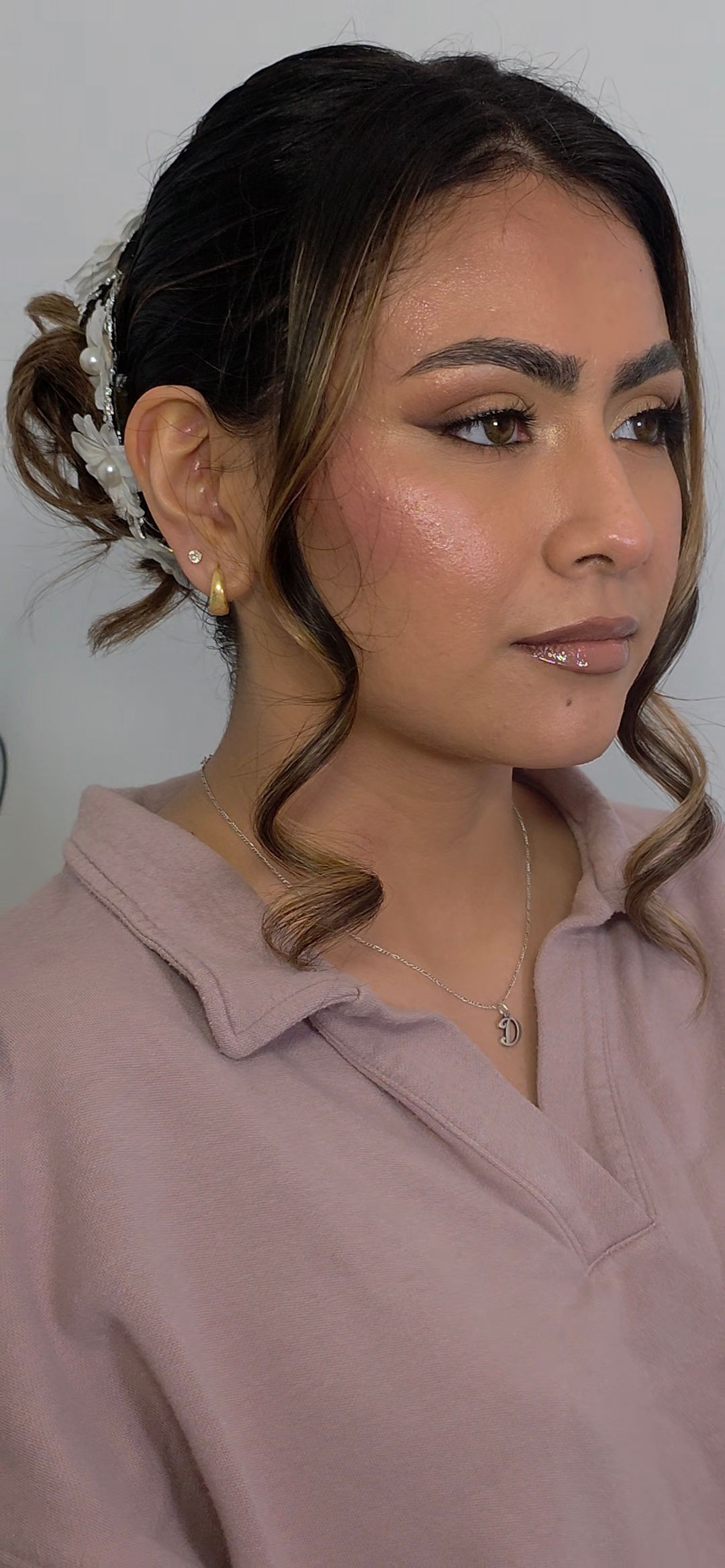 Elegant dark wavy hairstyle shown from multiple side angles.