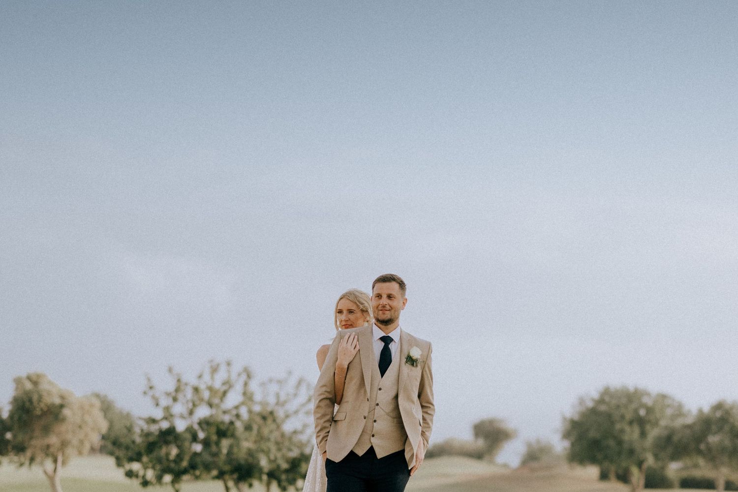 Cyprus wedding photographers based in Paphos and Limassol taking photos of the bride and groom during sunset.