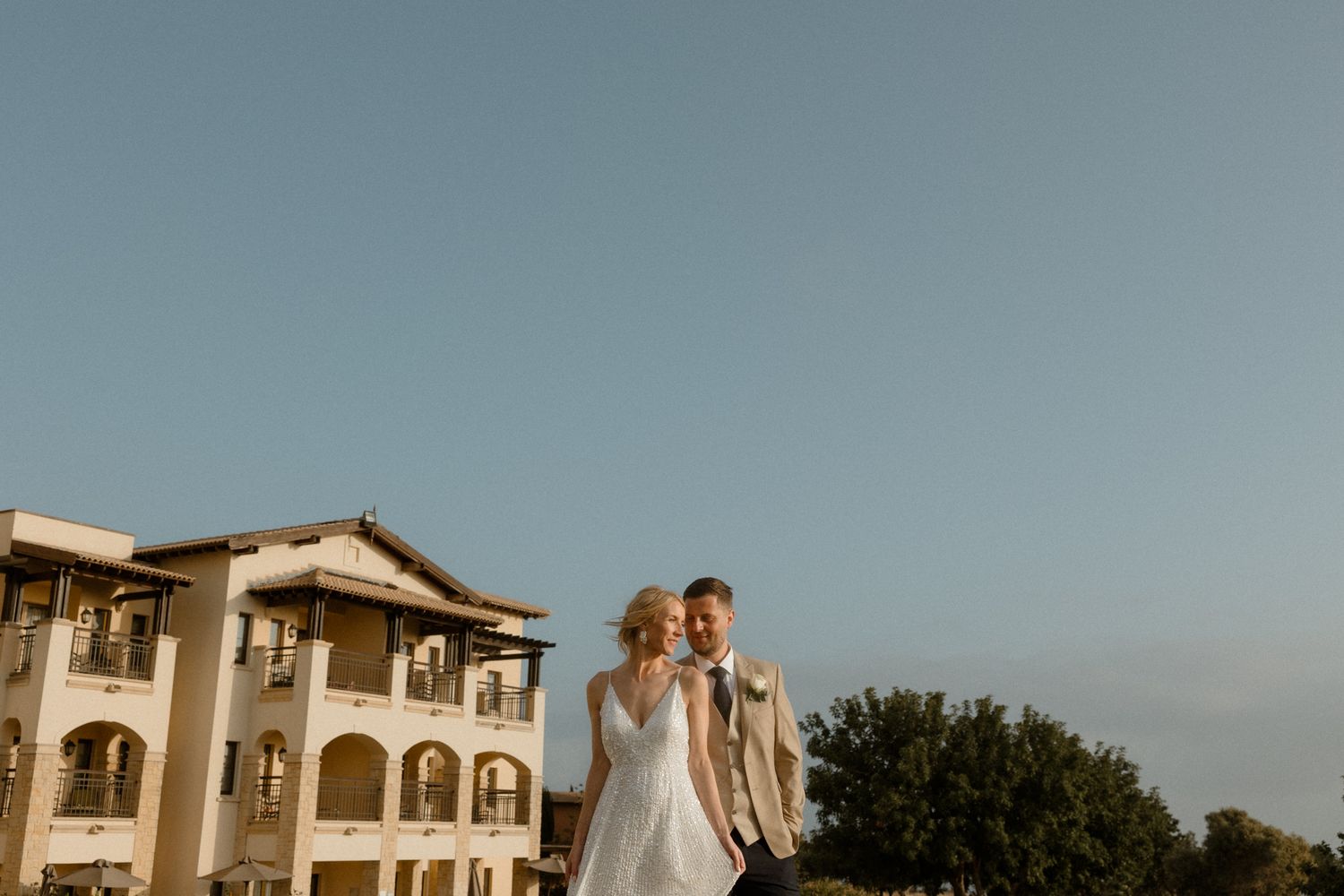 Cyprus wedding photographers based in Paphos and Limassol taking photos of the bride and groom during sunset.