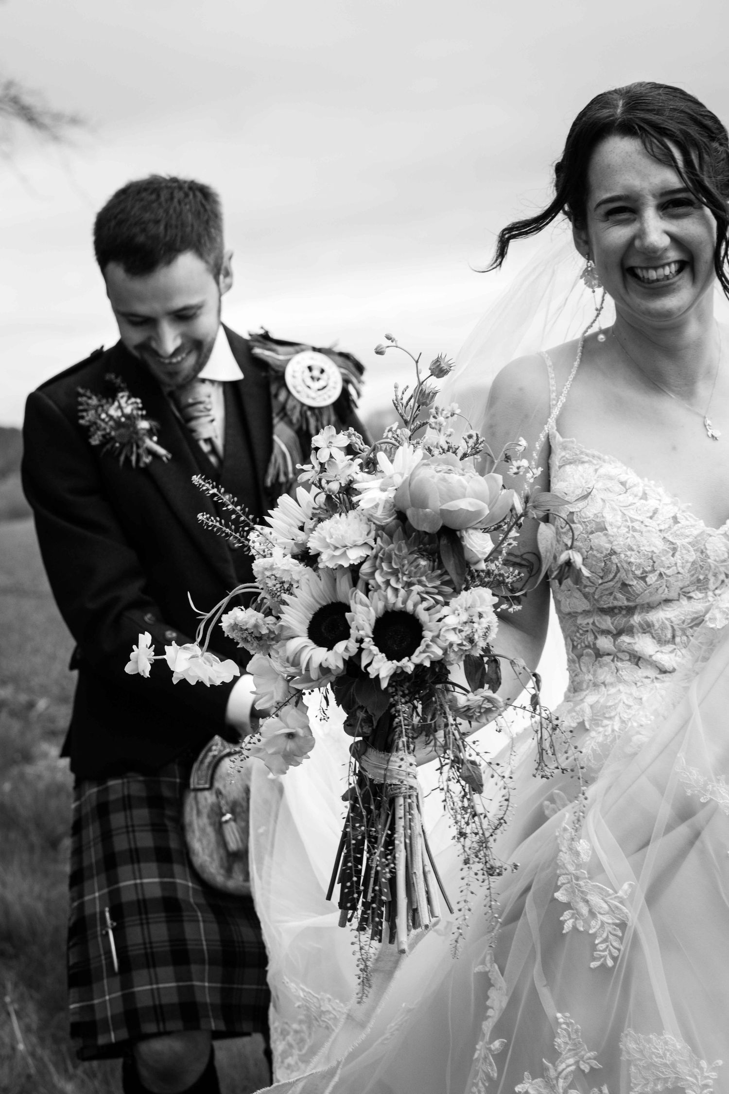Black and white wedding photograph series showing bridal bouquets with white flowers and elegant floral arrangements.