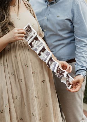 Close-up series showing hands holding ultrasound photos in a romantic outdoor setting.