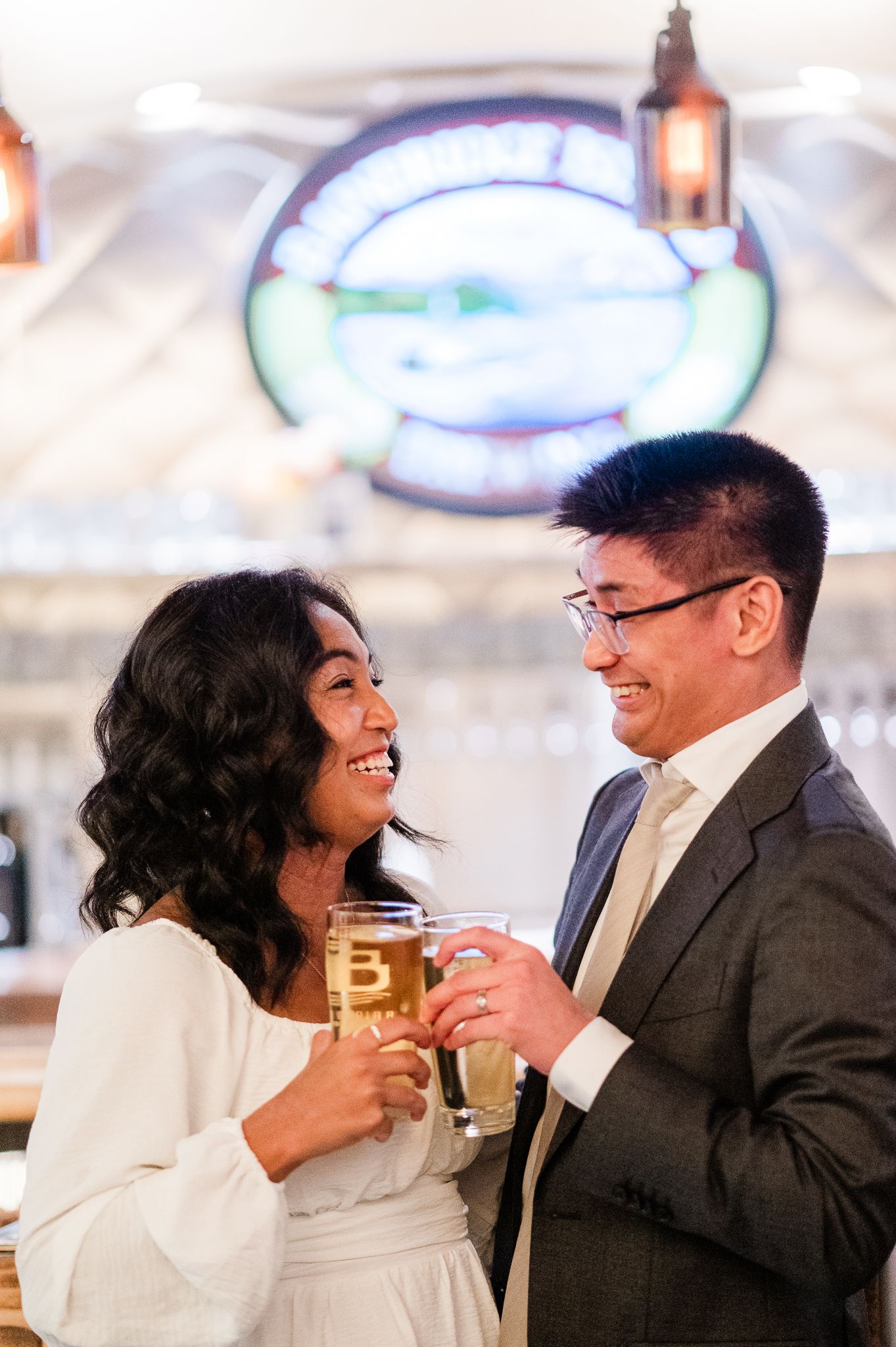 Bride and groom share joyful laughter together during their Bainbridge Island Elopement reception