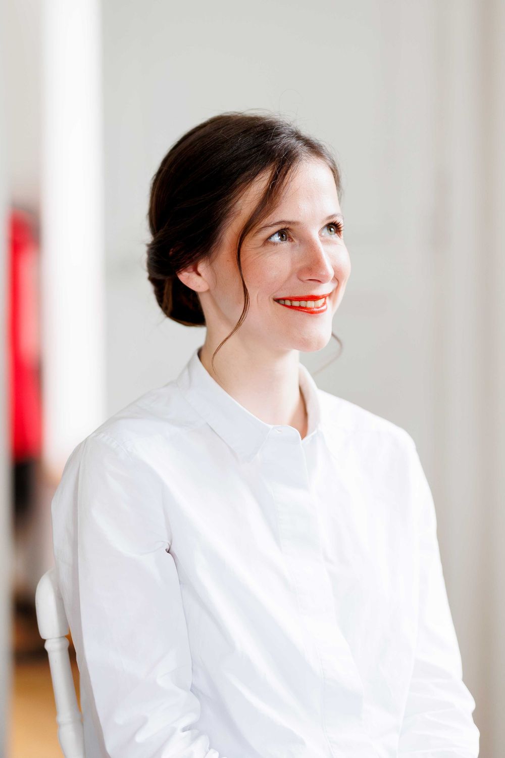 Professional portrait series showing a bright smile and white button-down shirt against a light background.