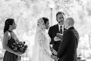 A series of black and white wedding photos showing romantic moments between couples during their special day.